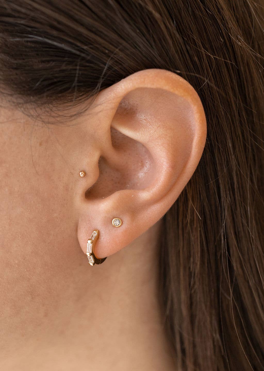 Clear CZ Baguette Huggie Hoops in Gold - Earrings